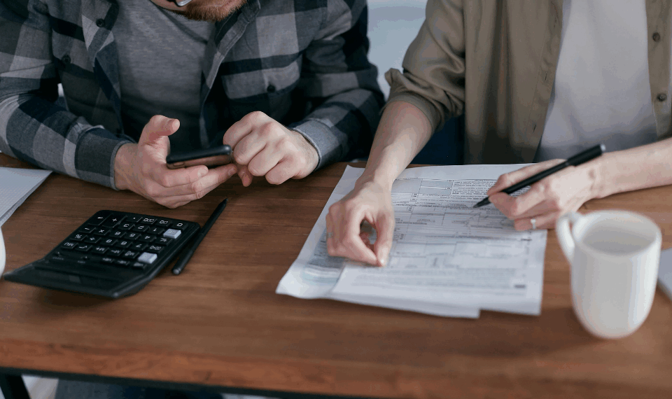 People going through documents at the table