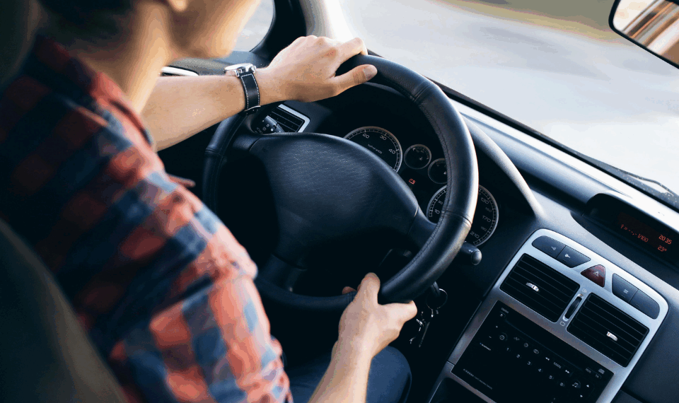 Guy driving a car