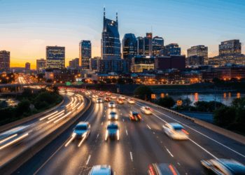 Cars driving on a street in Nashville TN at night