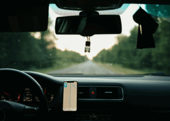 Car dashboard with phone in holder
