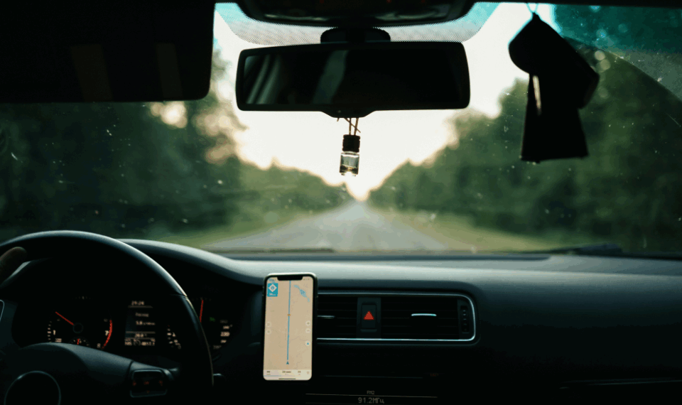 Car dashboard with phone in holder
