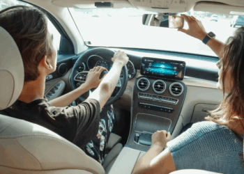 Interior view of two people sitting in a car